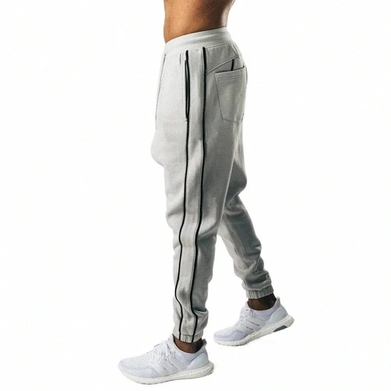 Nya joggingbyxor män sport tröjor som kör byxor byxor män joggar Cott Trackpants Slim Fit Bodybuilding Trouser 38rl#