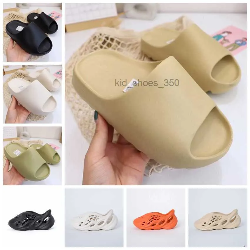 Modeontwerper Baby Jeugd Kinderslipper grote peuter Bone Slide Rubberen schoenen Klomp sandaal akoestische eva Zwart Maangrijs Slippers baby Tainers roet Strandsandalen