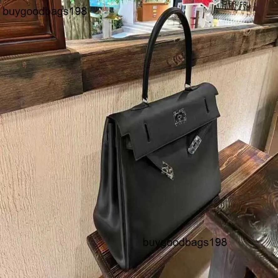 Les sacs à main de créateurs Xiao C recommandent le voyage en cuir de vachette, les hommes et les femmes ont le logo Dtea