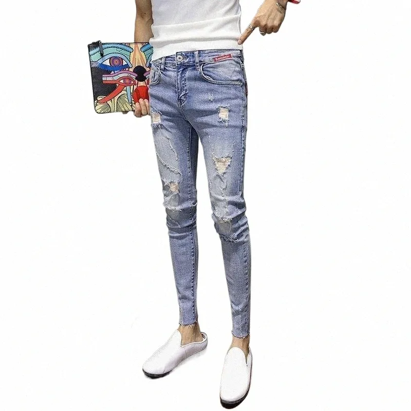 Neue Frühlings-Sommer-Cowboy-koreanische Art-beiläufige dünne Jeans feste Denim-FI-Mann-Strecken-feste zerrissene Bleistift-Hosen X7Hd #