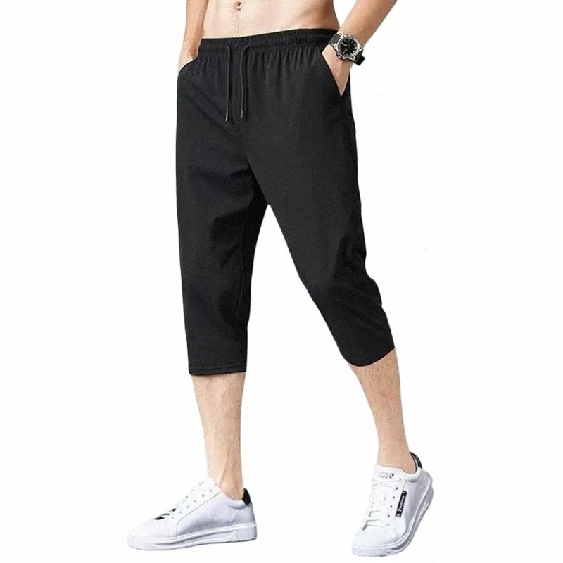 Męskie sprężyste spodenki sportowe szybkie suche szorty treningowe z kieszeniami swobodne sportowe szorty gimnastyczne luźne 3/4 spodnie jogger y8hu#