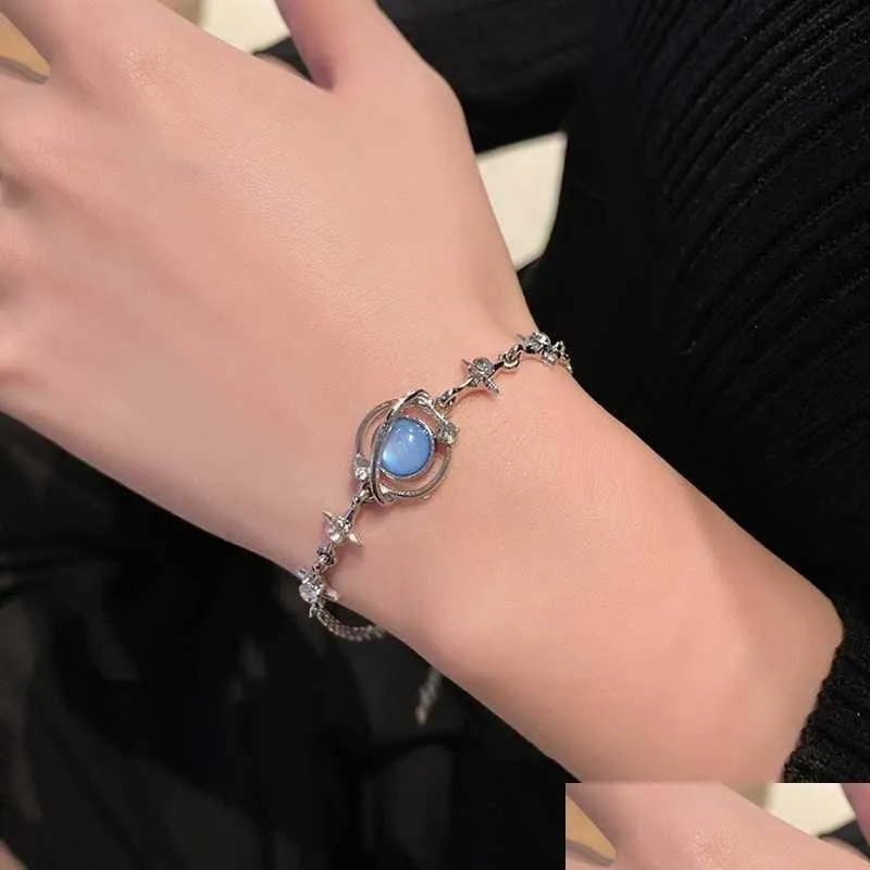 Bracelets de charme 2023 Nouveaux bijoux de mode coréenne Design personnalisé Planète entourant le bracelet pour femmes Blue Opal Chain Drop Delive Otpq0