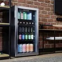 A Beverage Cooler Beside a TV in a Man Cave