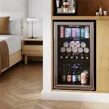 A Beverage Cooler under a Cabinet in a rental type Room