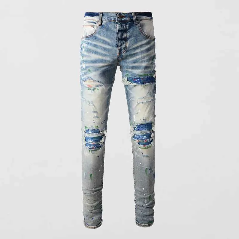 Męskie dżinsowe mody dżinsy retro niebieskie elastyczne ciasne dżinsy Otwórz przednie dżinsy Męskie przyciski Patch Patch Projektant Hip Hop Brand Pants J240328