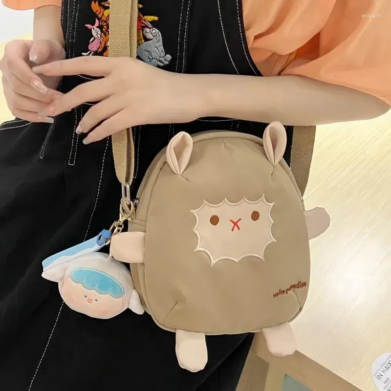 Дизайнерские сумки на ремне, нейлоновая милая мультяшная овечья сумка для женщин, 2024 INS, японская универсальная сумка через плечо для мобильных девочек
