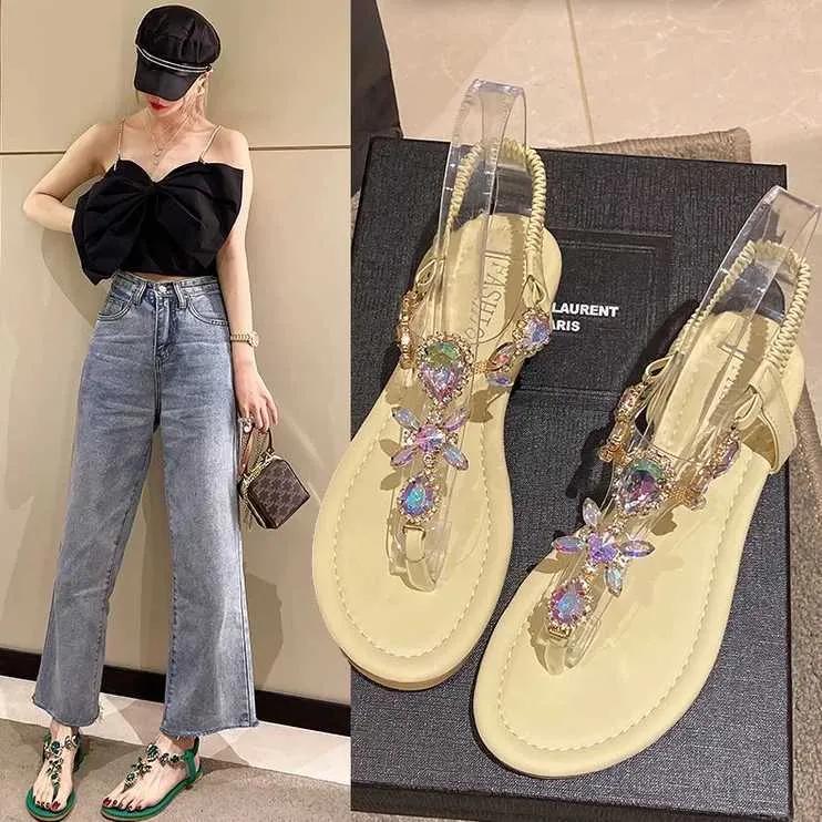 Sandali 2023 Estate Appartamento Donna Crystal Clip Toe Slide Trend Scarpe di lusso Stivali in pelle da spiaggia H240328OTQC