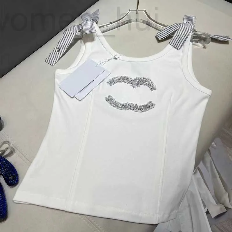 Tanques femininos camis designer 2024 primavera/verão novo produto magro aparência branco tanque topo pérola embelezamento pendurado cinta para mulher q2r1