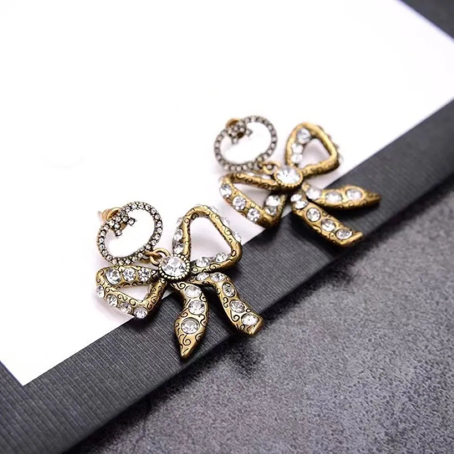 Luxus Designer Mode Charme Ohrring Aretes Messing hochwertige Bogen Ohrringe Damen Party Liebhaber Geschenk Schmuck251Z