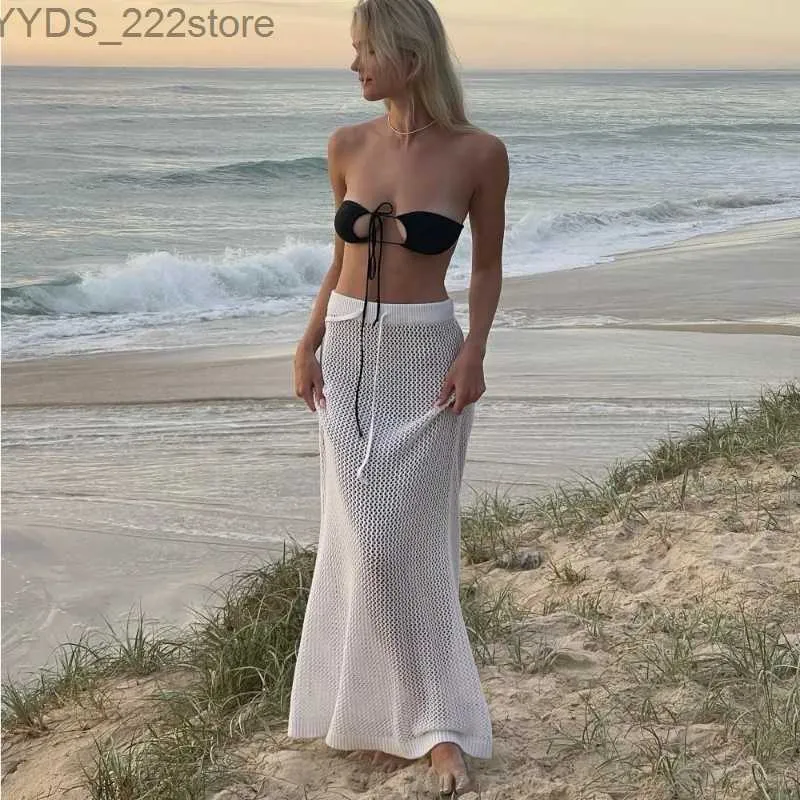 Spódnice Skorty Summer Sexy Hollow Out for Women 2024 Beach Casual Womens Lace Up Długi spódnica Kobieta Wakacja Postrzegana przez sukienkę YQ240328