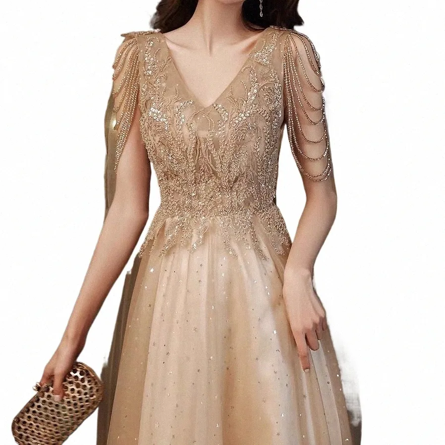 Champagne Gold Evening Dres avec Cape A Line Sexy Sexy V-Cold A-Line Shiny Luxury Luxury Beading Châle Formeal Celebrity Prom Robes New W0yl # #