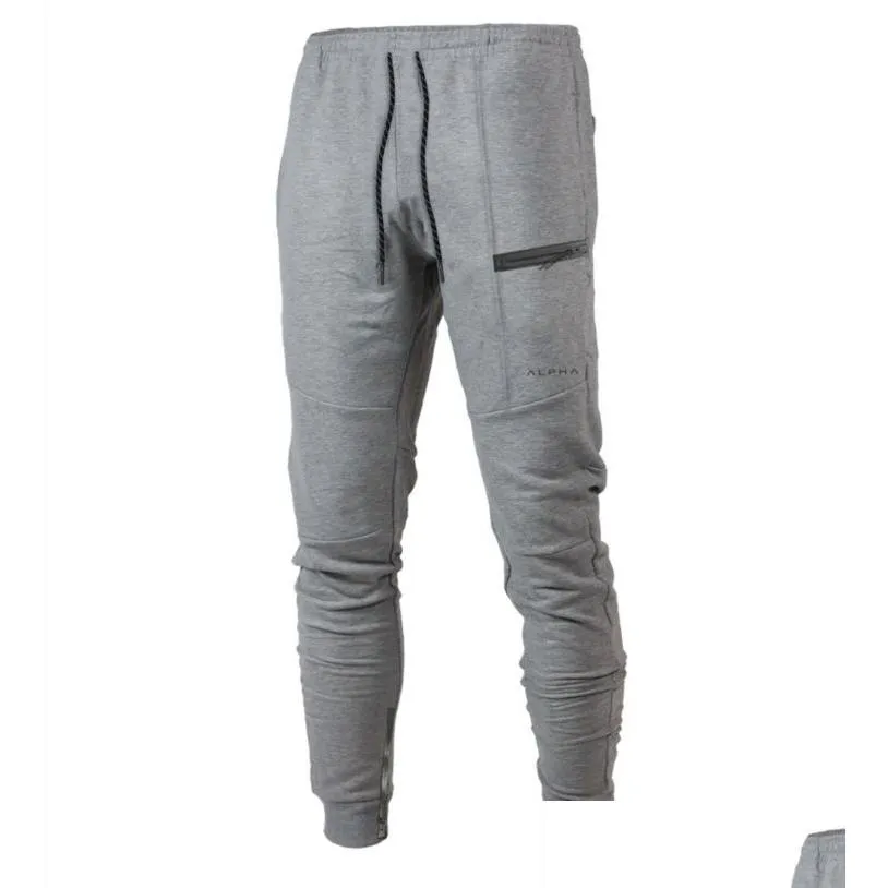 رجال السراويل رجال الركض العضلات شقيق sweatpants الذكور ألوان الصلبة غير الرسمية الصالة الرياضية الرياضية برازين رياضي إسقاط الملابس ملابس الملابس DH1H4