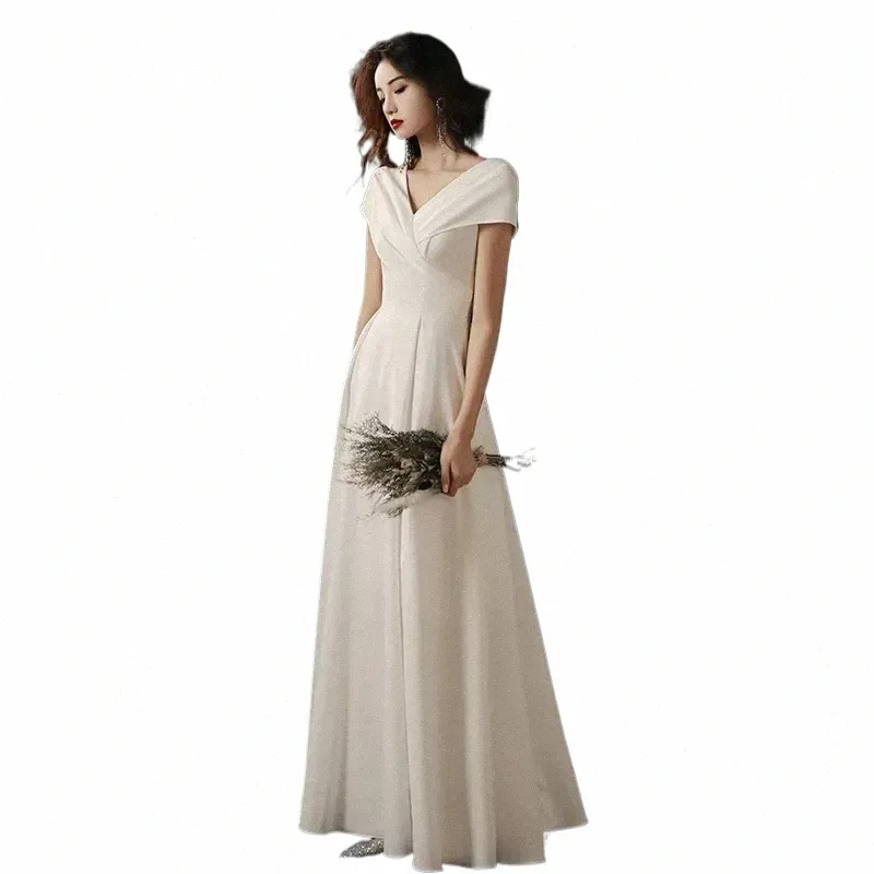 long empire waist evening dress with short flutter sleeves Alex Evenings Embroidered Sequin Empire-Waist Dress - Navy main image 1