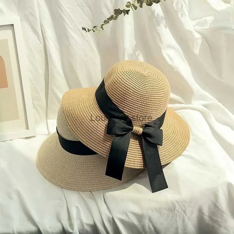 Cappelli a tesa larga Secchio Cappello da spiaggia estivo genitore-figlio casual marca Panama a tesa piatta con fiocco in paglia Ragazze sole H240330