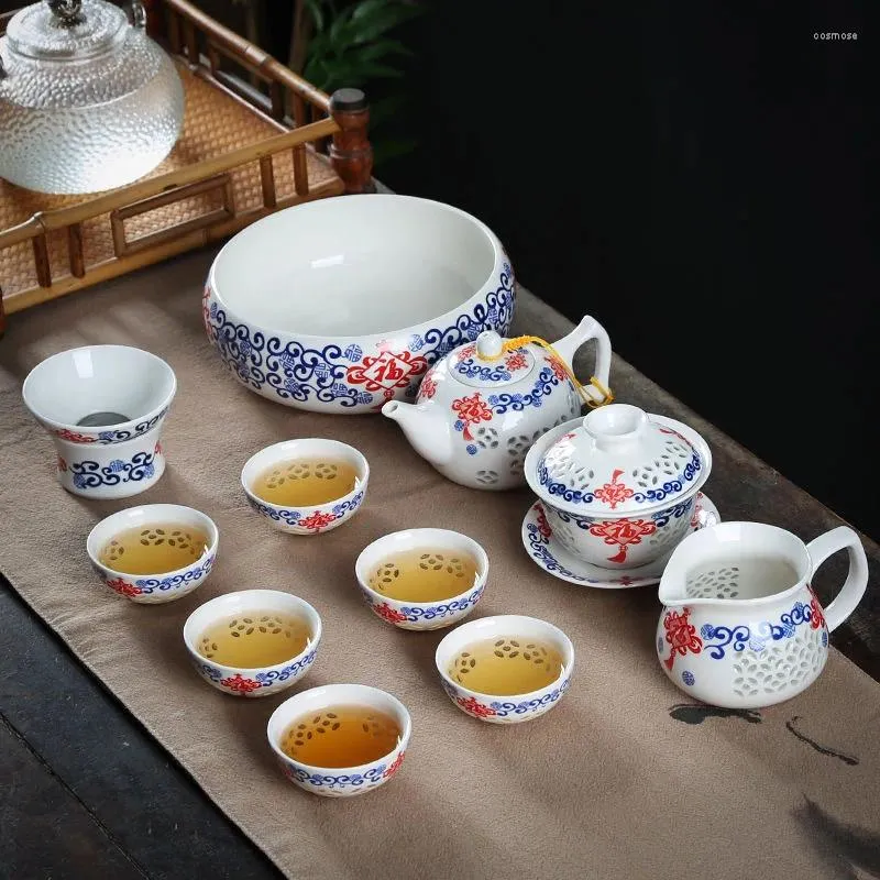 Set da tè 11 pezzi Set da tè a nido d'ape cavo Set da tè in porcellana blu e bianco Tazza da tè in vetro ceramico Teiera Gaiwan Colino Tazza fiera