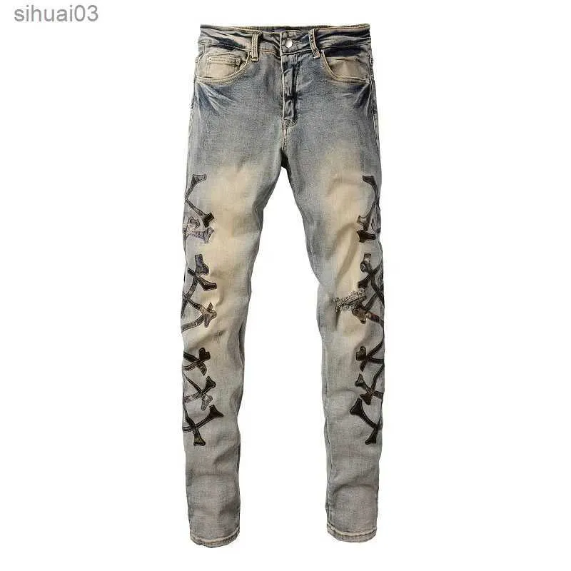 Men's Jeans Mens camouflage leather bone patch jeans with retro blue elastic denim thin tapered pants with torn distressed TrousersL2403