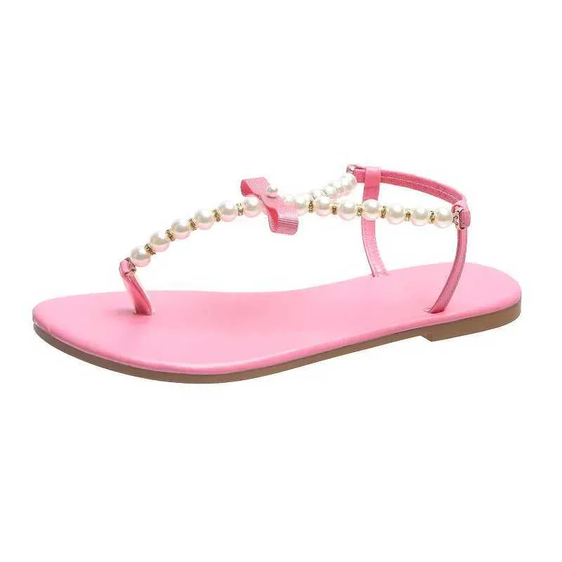 Sandaler Summer Womens 2023 New Fashion Outdoor Flat Beach Sexig Pearl Bow-Knot Shoes Female Clip Toe Flip Flops Slides H2403280ide