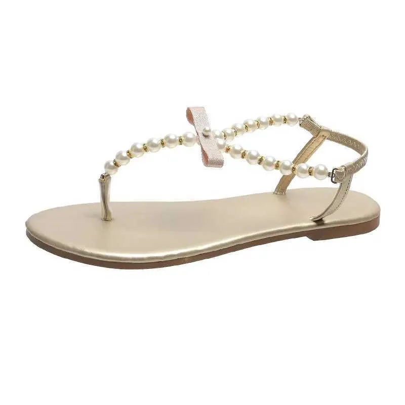 Sandalet Yaz Kadınları 2023 Yeni Moda Açık Düz Plaj Seksi İnci Yay Knot Ayakkabıları Kadın Klip Ayak Ayak parmağı Flip Slaytlar H240328Vehx