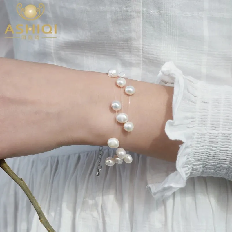 Ashiqi White Natural Freshwater Baroque Pearl Armband för kvinnor med 3 rader Transparent fiskelinje Invisibel kedja 240319