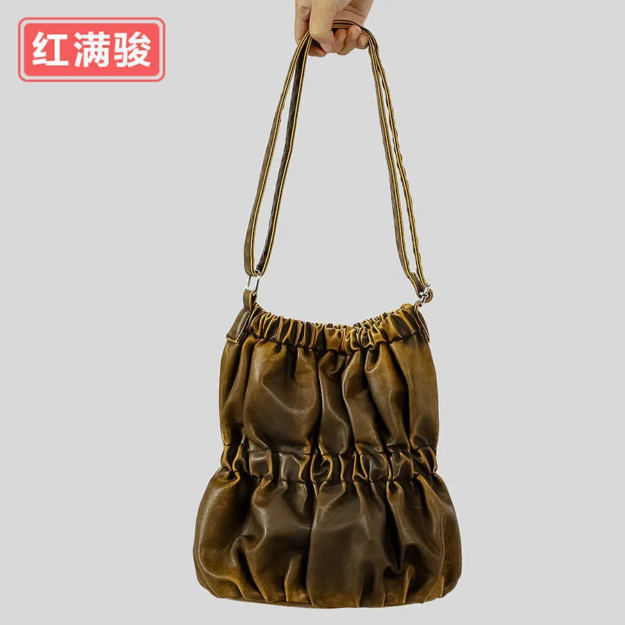 Vecchia borsa a secchiello elastica plissettata da donna con borsa a tracolla con superficie morbida di grande capacità, borsa tote dal design di nicchia
