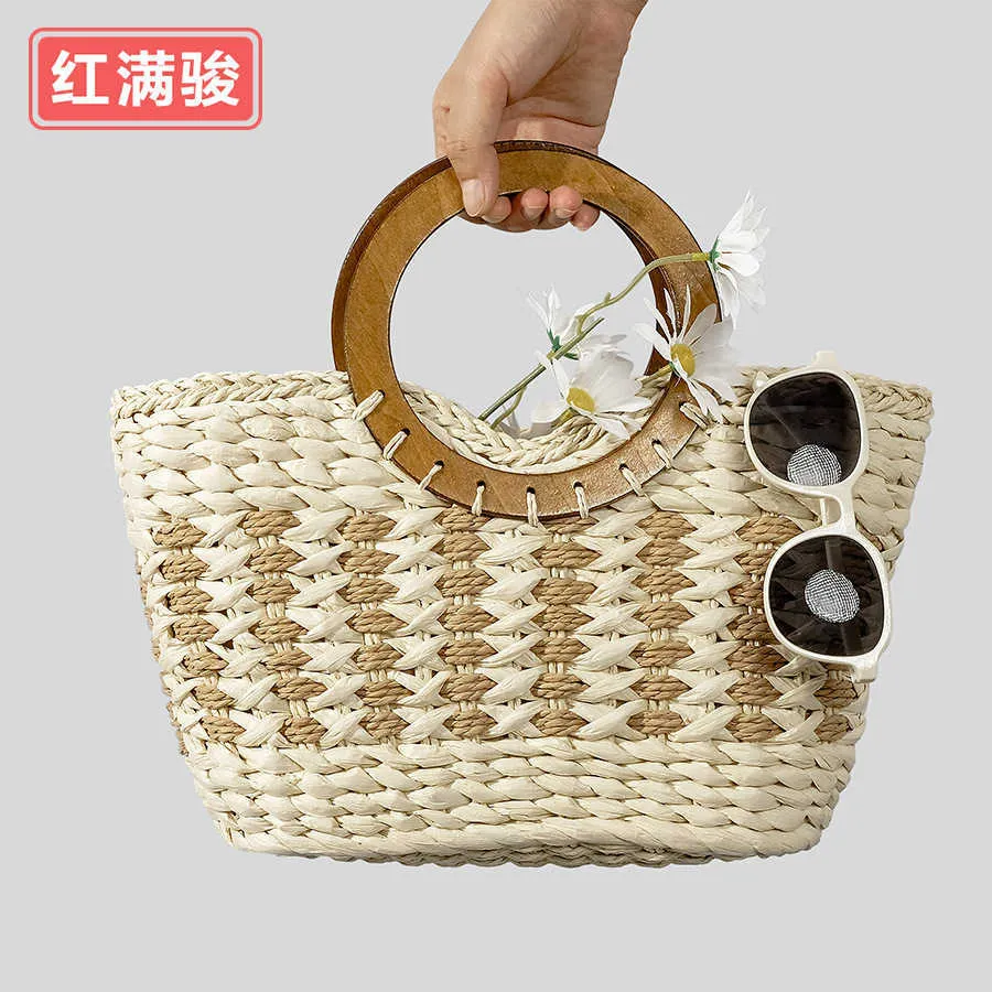 Spring and summer handmade woven wooden handle grass woven bag for women's forest style seaside vacation handbag, niche striped woven bag