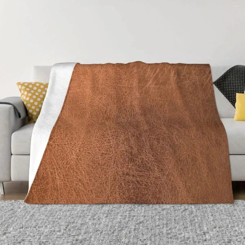 毛布を着用した茶色の革のルークスローブランケット装飾のソファは、赤ちゃんの装飾のためにゆるい