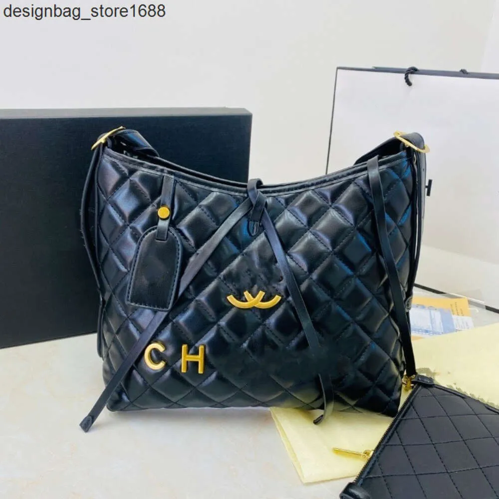 Sac à bandoulière Designer Usine Discount Unique Grand Sac Femmes 2024 Début Printemps Nouvelle Mode Industrie Lourde Grille Mère Capacité Banlieue Fourre-Tout Marée