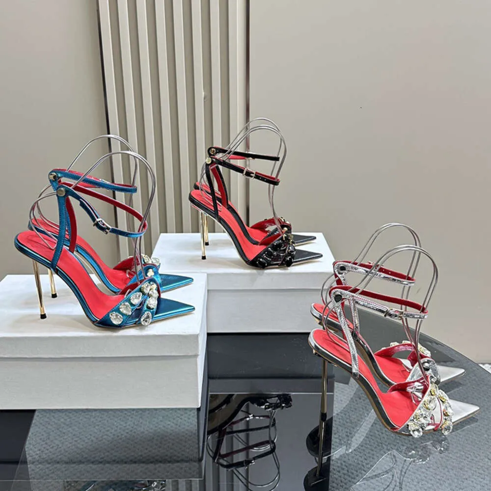 Bühnen-Runway-Stil, offener Zehenbereich, hohl, sexy Metall-Sandalen mit schmalem Absatz, Kristall-Sandalen mit spitzer One-Line-Schnalle und Strass-Super-High-Heels