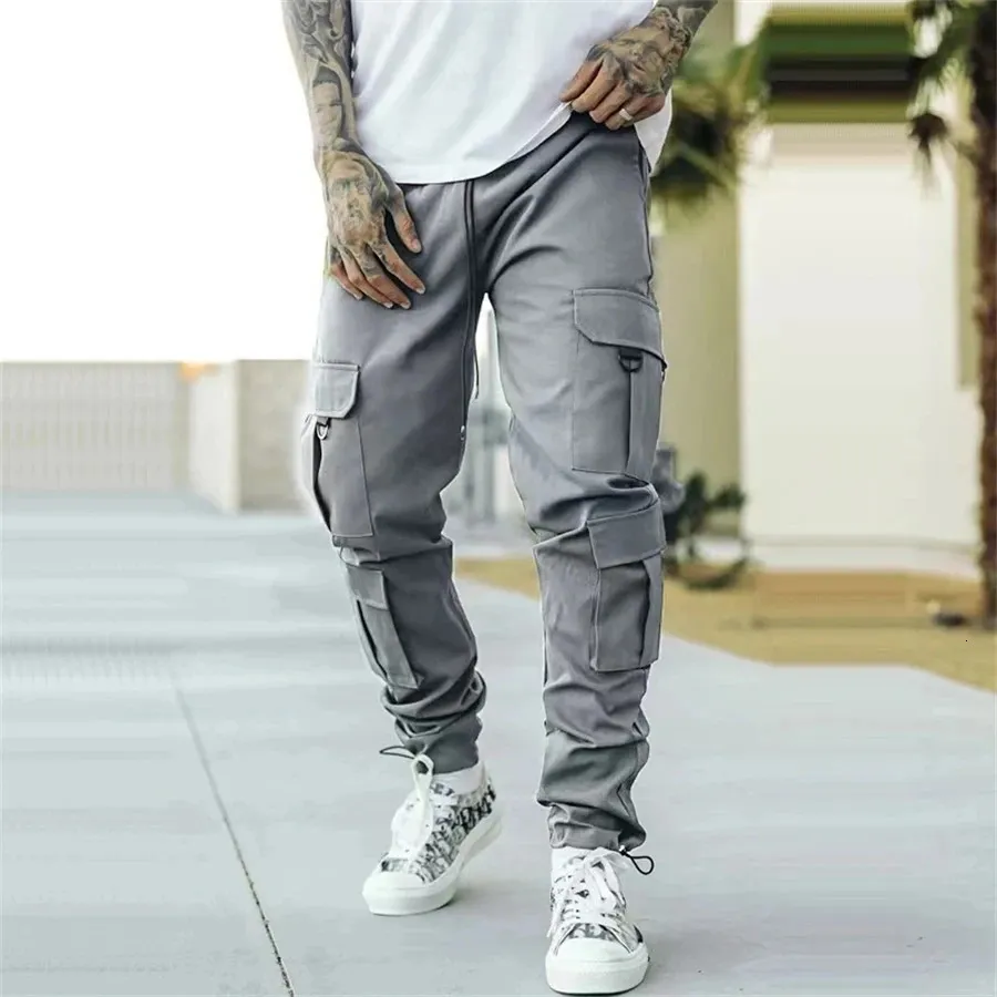 Jesień mężczyźni Spodnie towarowe joggery dresowe patyczne męskie spodnie sportowe Hip Harem Spodnie Slim Fit 240325