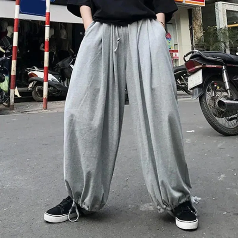 Herrbyxor kvinnor joggar sweatpants män lykta bred ben lös djup gren elastisk midja ankel längd fast färgfickor unisex lång