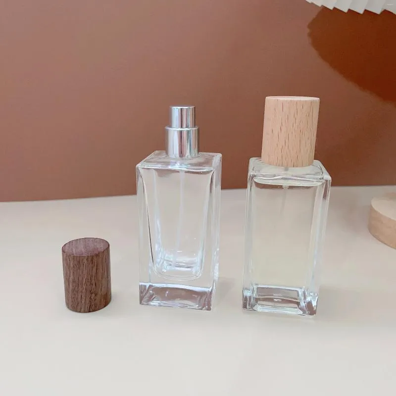 Speicherflaschen 50 ml Parfümsprühflasche großer Kapazitätskosmetischer Kosmetikspender mit Holzkappe tragbarer Behälter