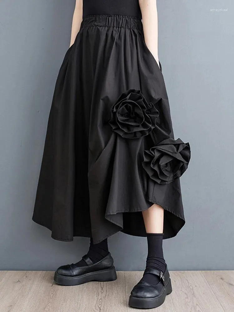 Spódnice czarne vintage spódnica z wysokiej talii kobiety nieregularne splicowane kwiatowe moda plus moda luźna swobodne ubrania midi lato 2024