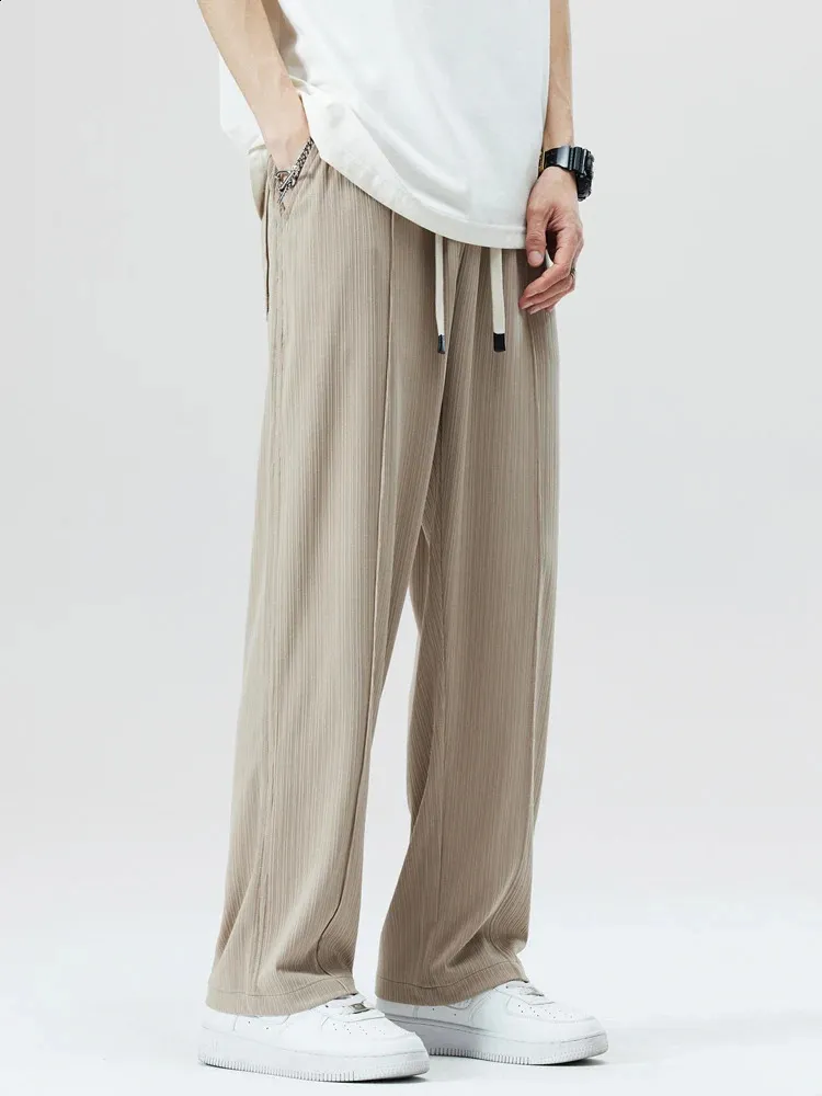 Summer Cool Sweetpants Mężczyźni proste swobodne spodnie Koreańska moda na pół całej pasmowej paski drapy luźne spodnie Mężczyzna 240422
