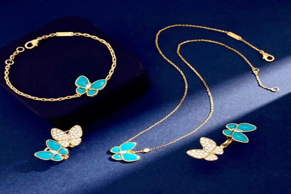 Europe America Bijoux de mode Ensembles Lady Femmes Cadre en laiton Diamond turquoise 18k Gold Deux boucles d'oreilles à bague papillon Bracelet Neck6237488