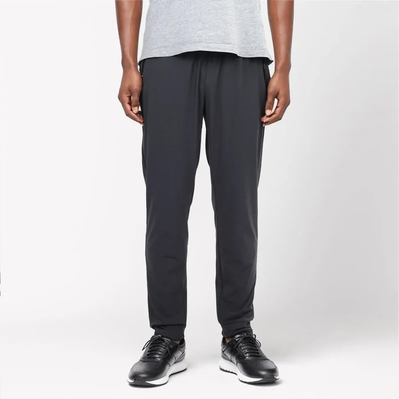 Pantalon masculin Couleur pure avec les poches entraînant un pantalon décontracté de basket-ball qui coule le jogger pour l'homme mince pantalon d'été