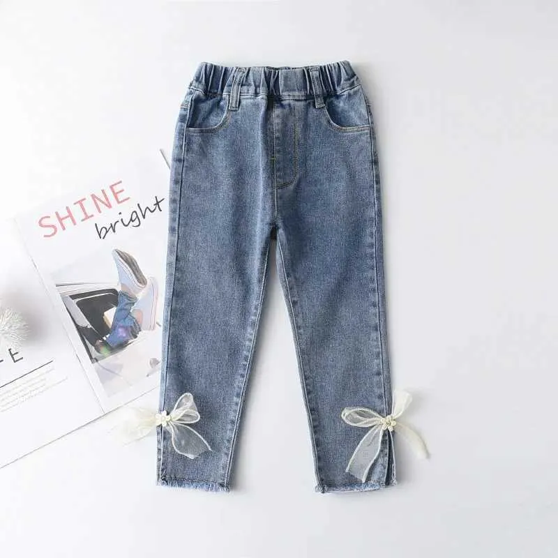 Broek 2023 Nieuwe 2-7y jeans meisjes elegante boog denim broek zoete boog elastiek elastiek schattige lente kinderbroeken baby pantsL2403