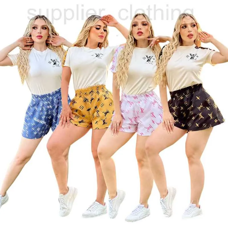 Diseñador de pantalones de dos piezas para mujeres Nuevas mujeres de verano Traje corto casual Sportswear Mangas estampadas y pantalones cortos Ropa de carrera de la mañana SLR4