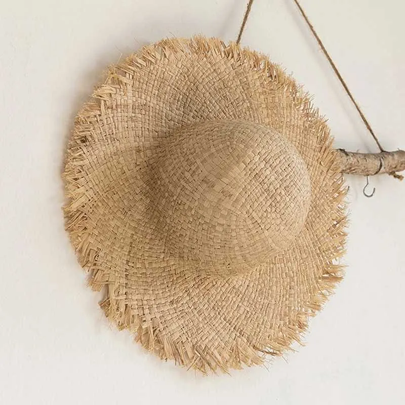 Chapeaux à bord large chapeau seau de seau d'été Natural Raffiah Sun chapeau pour femmes largeur fashion floppy shade dome str hat girl extérieur vacances hat de plage panama j240425