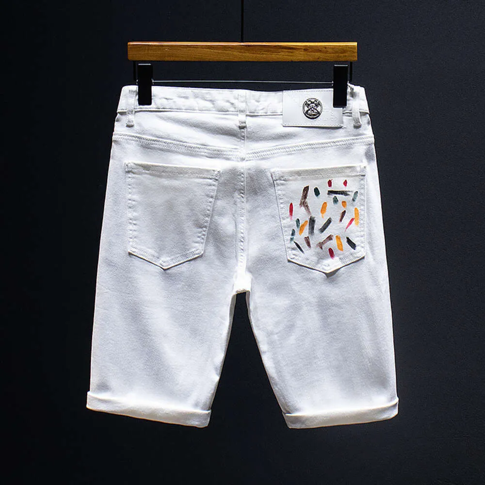 ファッション服のトレンディなブランド夏のためのハイエンドデニムショートパンツストレートチューブスプラッシュインク刺繍エラスティック汎用ショートパンツメンズジーンズデザイン