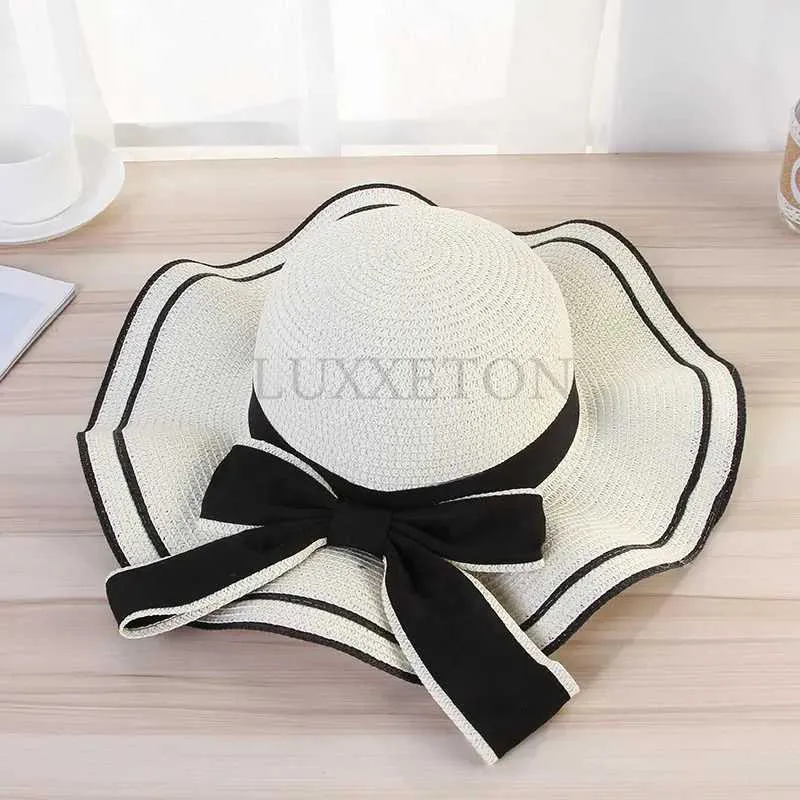 Chapeaux à bord large chapeau seau d'été femme aviron de plage de plage large edge femme décontractée panama chatte classique arc plat str du chapeau soleil féminin fedora cadeau j240425