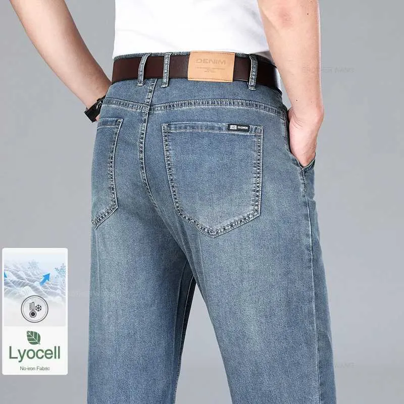 Heren jeans 2024 zomer dunne lyocell jeans heren ijs zijden drape zakelijke casual elastische denim broek los rechte broek merk kleding y240507