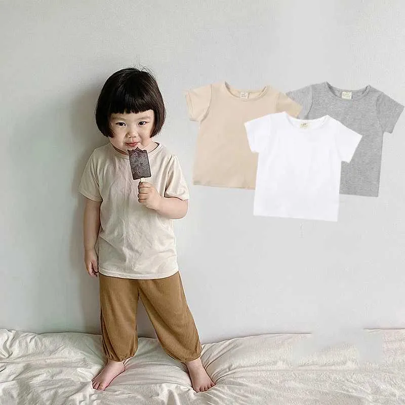 T-shirt 2024 Summer Nuovi camicie per ragazzi Cotton Topdini a colori solidi per ragazze per ragazze per bambini Topce per bambini Testi per bambini Bambini per bambini H240507