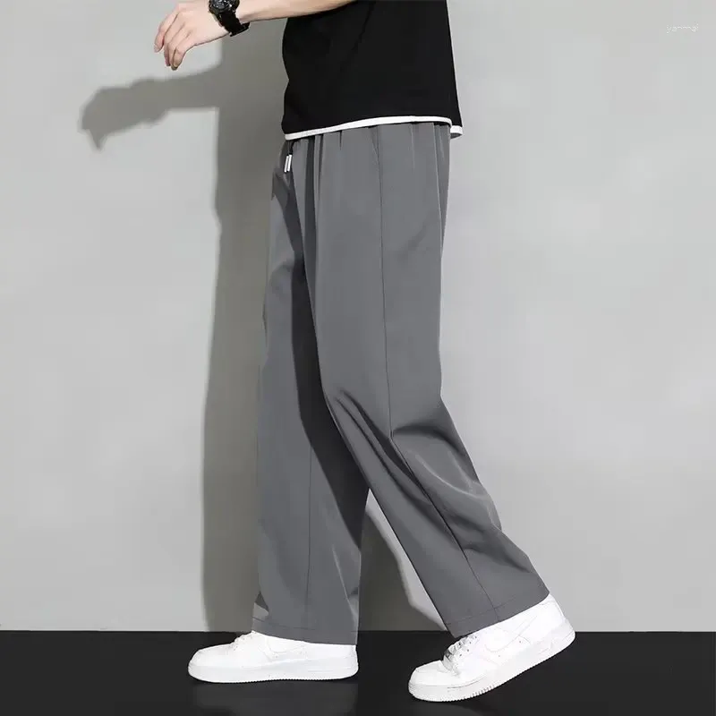 Pantaloni da uomo 2024 seta di ghiaccio estate asciugatura rapida pantaloni di nove minuti sciolti cento dritti e adatti a una comoda casual comoda casual