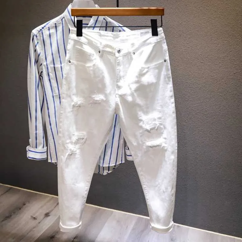 Męskie dżinsy nowe białe dżinsy dla mężczyzn w pełni dopasowane do modnych otworów łzowych Ultra-cienkie elastyczne spodnie haremowe wygodne męskie ubrania uliczne dżinsowe spodnie Q240509
