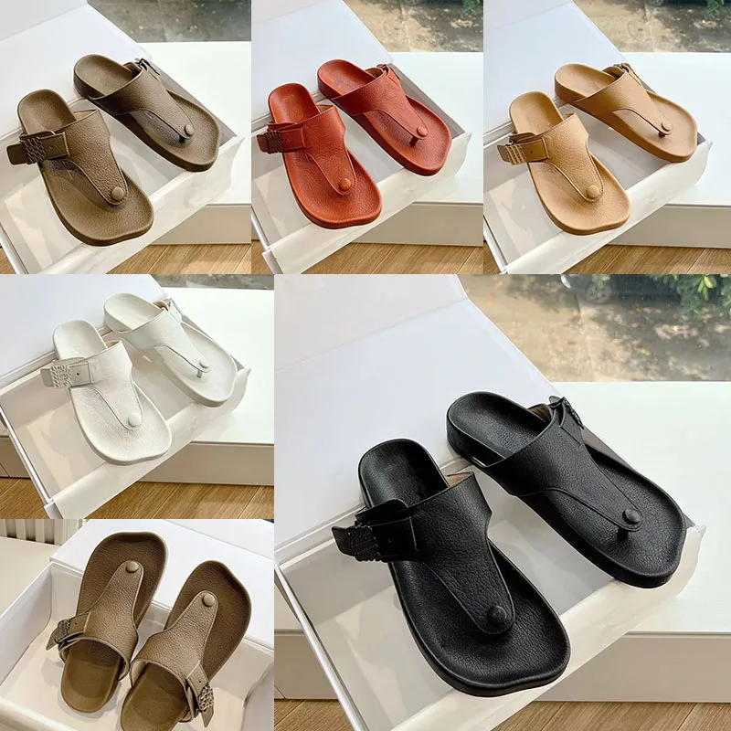 Luxe designer dameshoens pure kleur flip-flops slippers 100% lederen buiten strand carve patronen vintage sandalen sexy dame comfort round-te flat schoenen maten 35-44