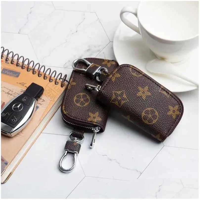 Key Wallets Designer- Auto-autorase mannelijke pu lederen sleutels houder vrouwen slimme huishoudster zipper sleutelhangje zakje portemonnee portemonnee drop levering ba dhujt