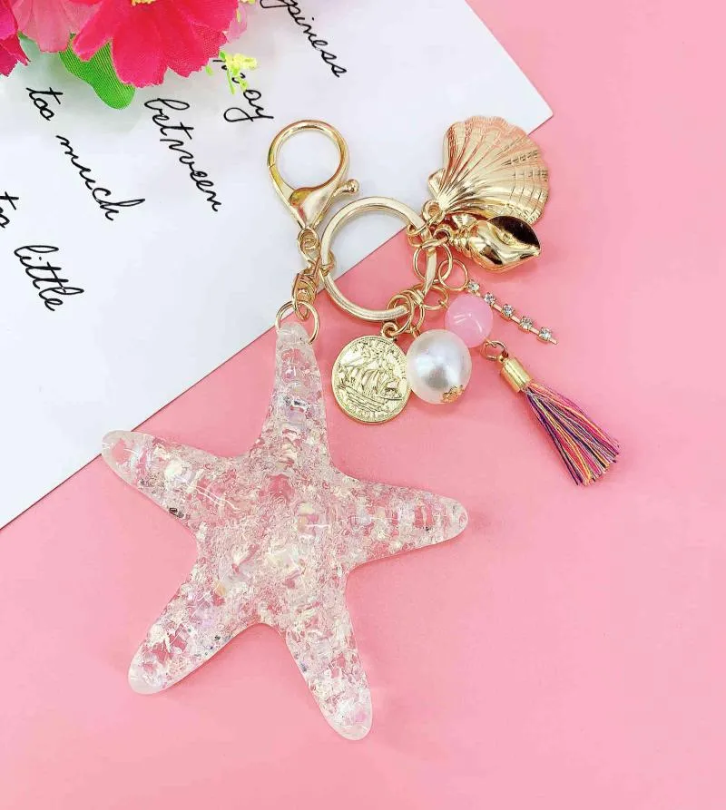 Nouveau dessin animé fantasque Sea World Pearl Shell Starfisf Keychain pentagram cristal chaîne dames sacs Car clé en alliage allié bijoux y8614058