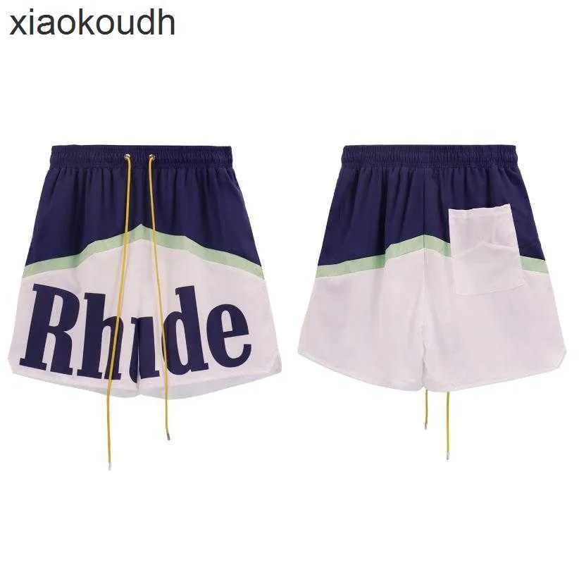 Rhude High End Designer Shorts for Fashion Letter Imprimer Shorts décontractés pour hommes Summer Loose Wide Jam Mesh Pantal