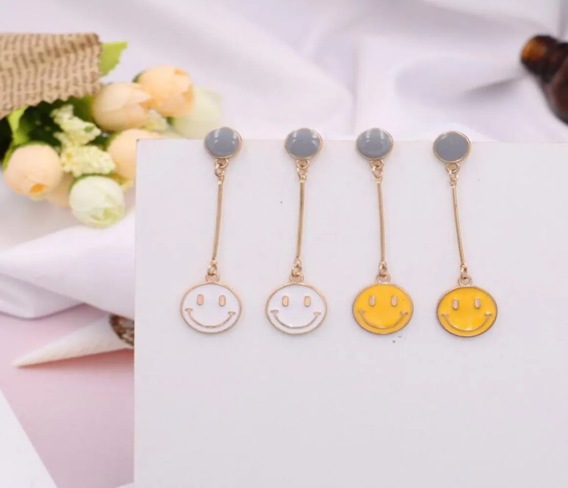 Boucles d'oreilles de mode jaune blanc souriant face earnails