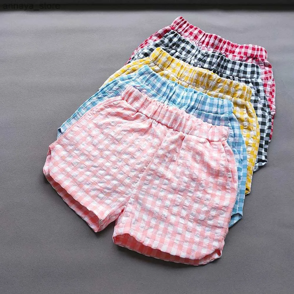 Shorts douces filles shorts à plaid d'été garçons et filles coréens coton coton shorts shorts de mode décontracté pantalon chaud pantalon pour enfants vêtements2405l2405